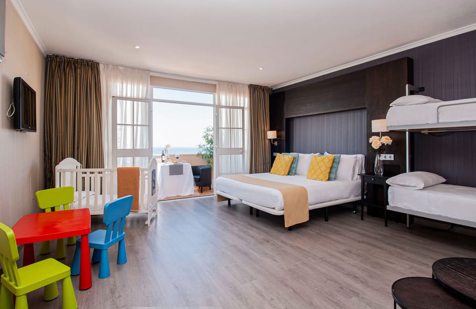 Family Room | Minibar, in-room safe, individually decorated, individually furnished