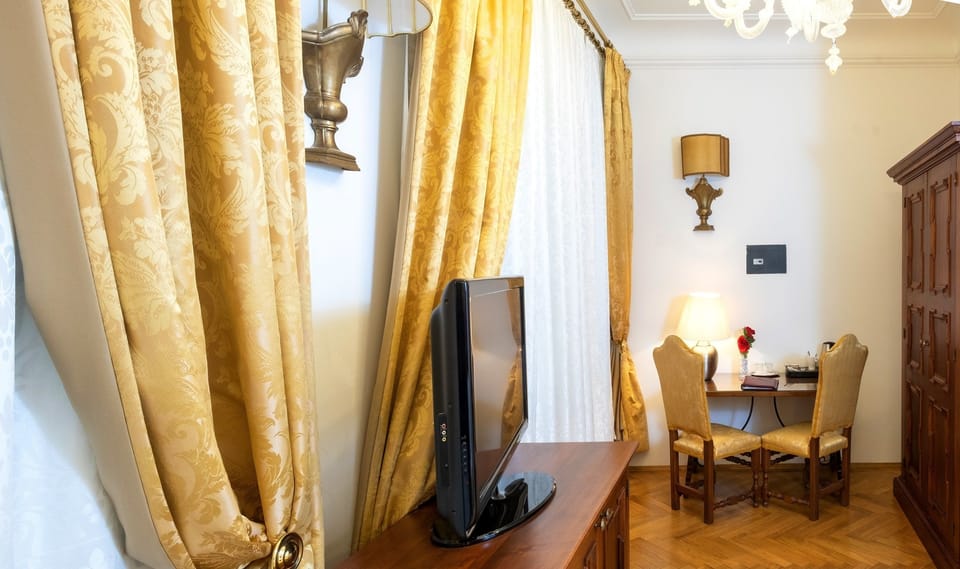 Economy Double Room, 1 Queen Bed, No Windows | Minibar, in-room safe, individually decorated, desk