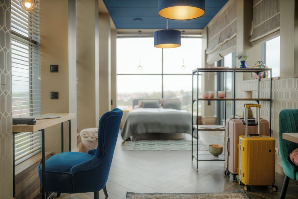 Deluxe Apartment, City View | Desk, laptop workspace, blackout drapes, free WiFi