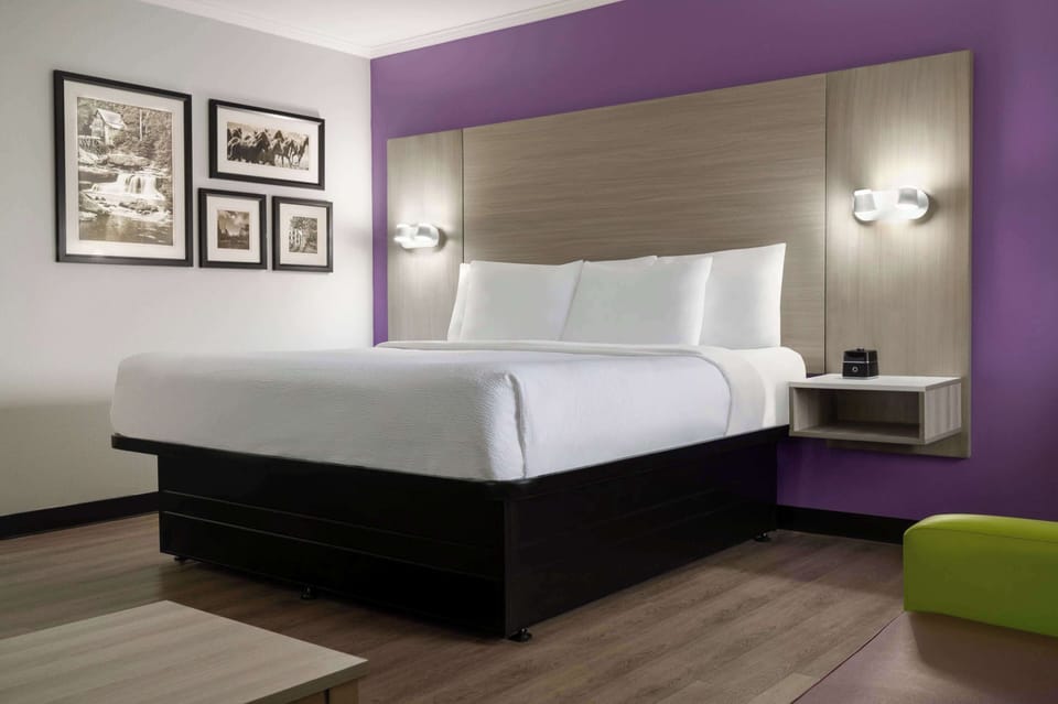 Premium bedding, desk, laptop workspace, iron/ironing board