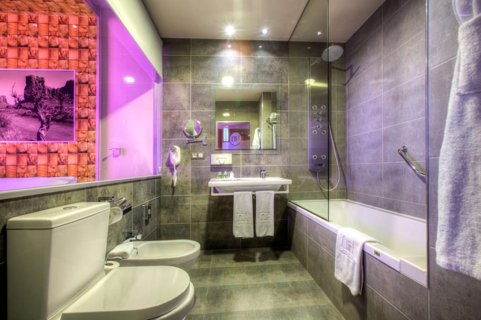 Eco-friendly toiletries, hair dryer, bidet, towels