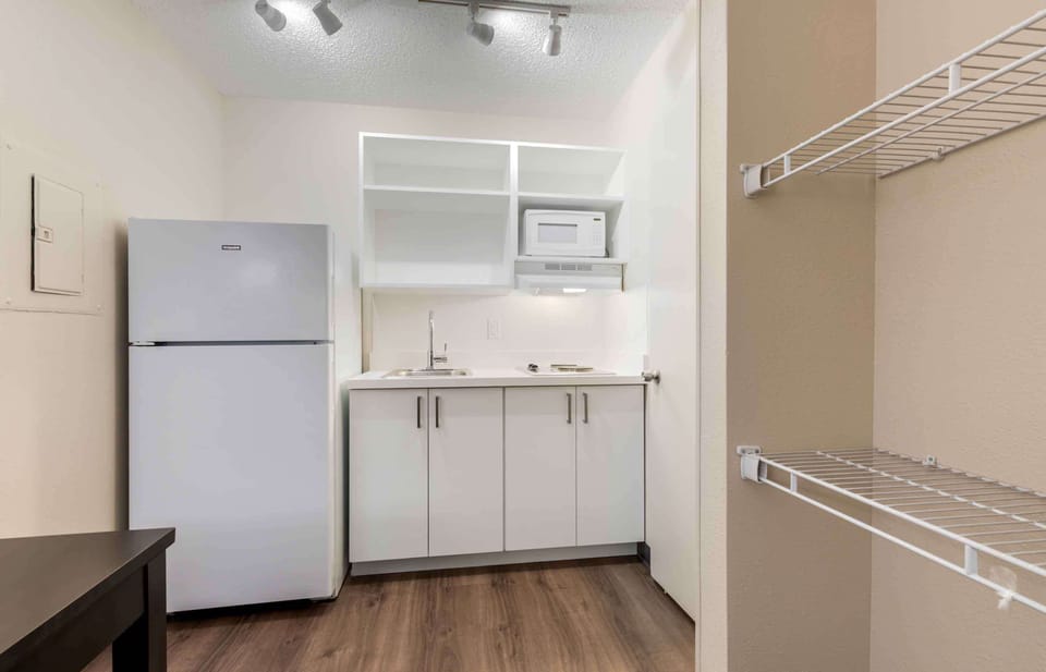 Studio, 1 Queen Bed, Non Smoking | Private kitchen | Coffee/tea maker, full-size fridge, microwave, stovetop