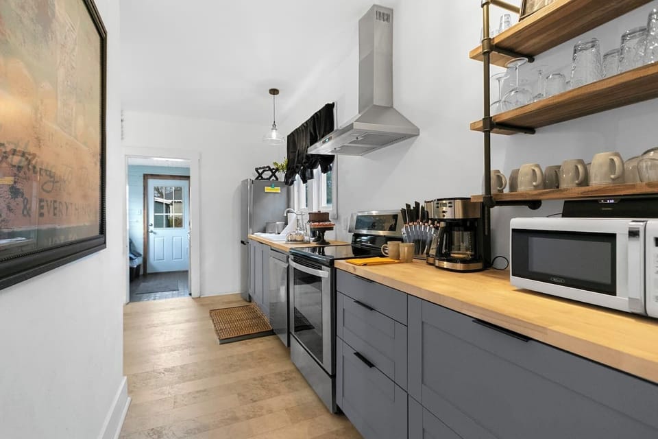 A galley kitchen with everything you need + extra seating and a selfie wall!.