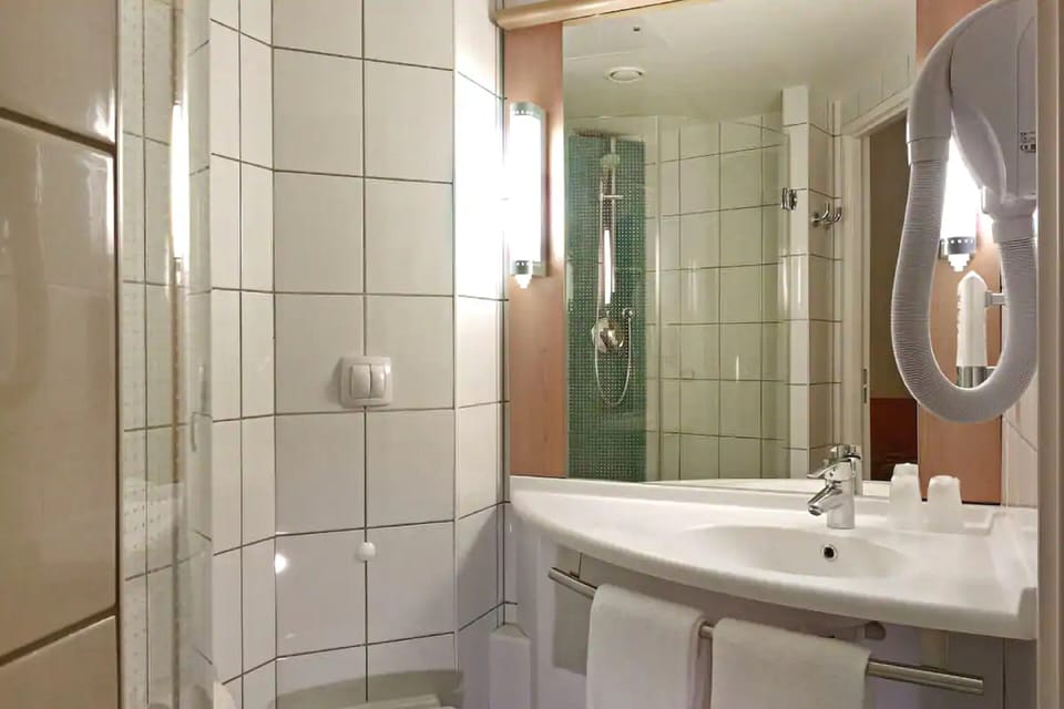 Shower, eco-friendly toiletries, hair dryer, towels