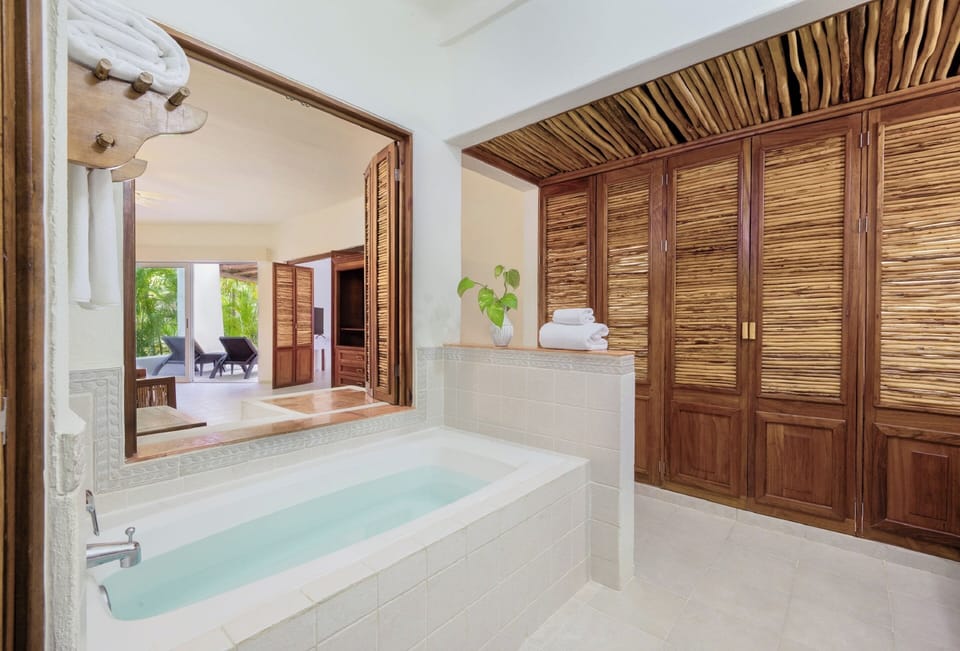 Separate tub and shower, rainfall showerhead, free toiletries
