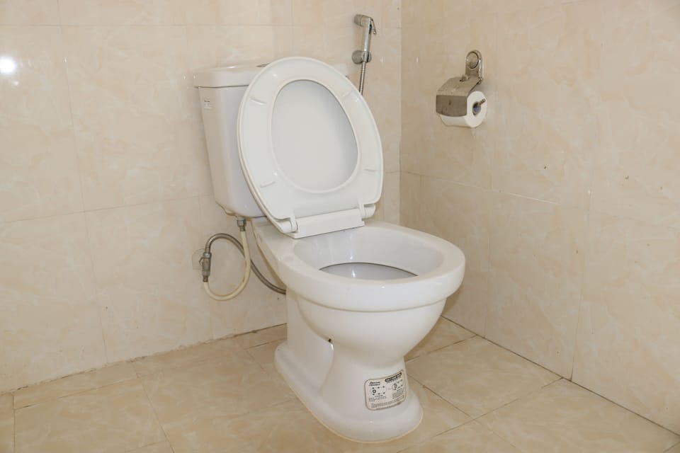 Shower, hair dryer, slippers, towels