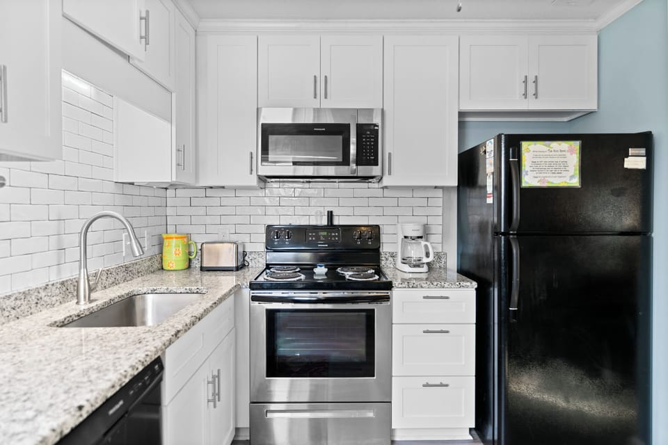Your fully equipped kitchen features modern appliances and granite countertops, perfect for preparing meals during your stay.
