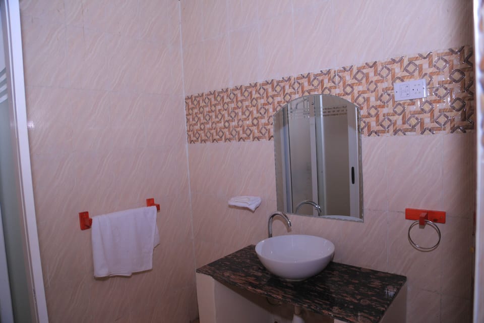 Shower, free toiletries, slippers, towels