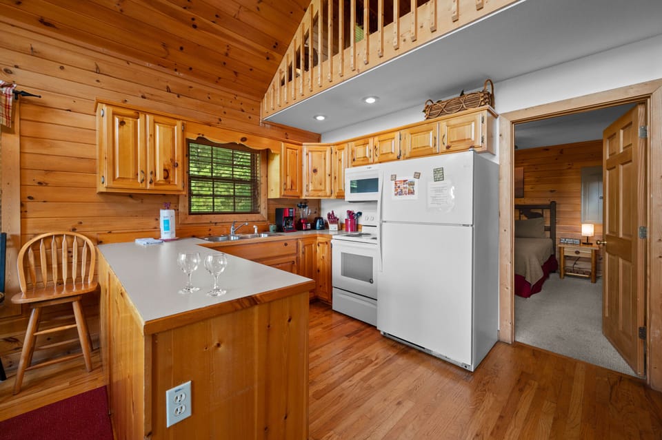 The spacious kitchen area is perfect for preparing meals with the family.