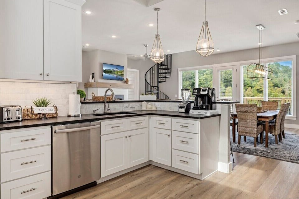 Large kitchen with stainless steel appliances.