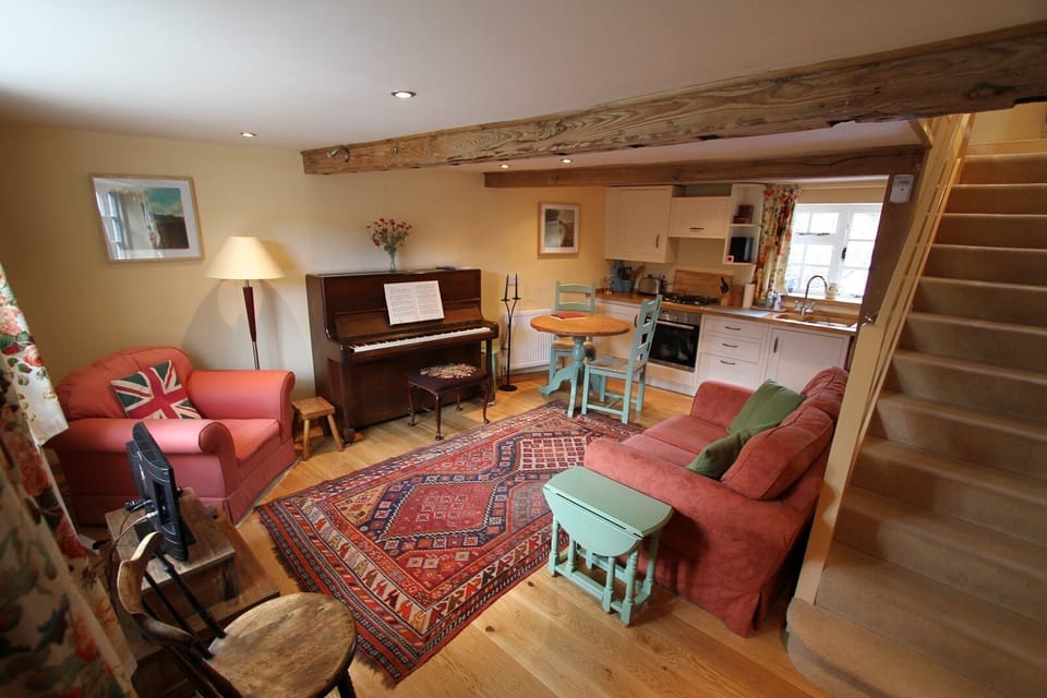 Open Plan sitting room and kitchen. With piano