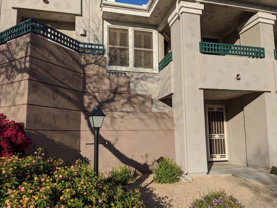 Condo has ground level entrance with a second story living space.a