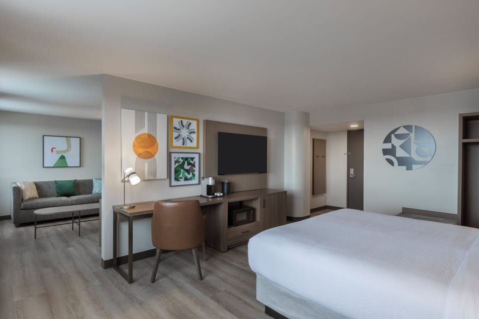 Suite, 1 Bedroom | Desk, laptop workspace, blackout drapes, iron/ironing board