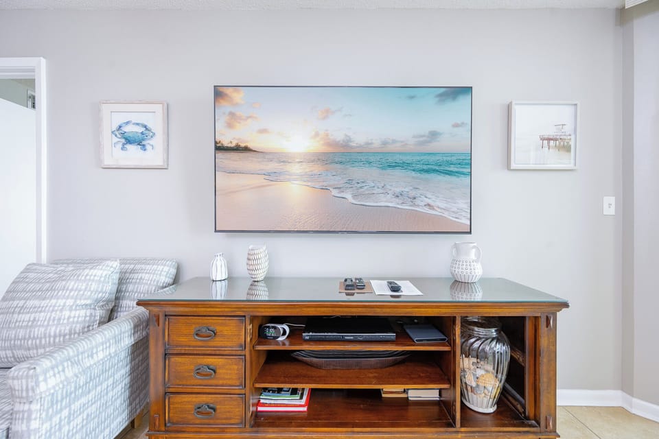 Relax on the soft couch while streaming your favorite shows, surrounded by beach decor that enhances your stay
