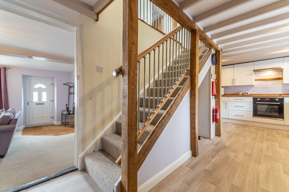 Ground floor: Stairs from the kitchen lead to first floor