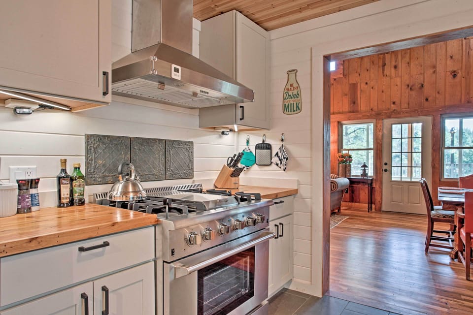 The kitchen has a professional 36" gas range and cedar countertops.