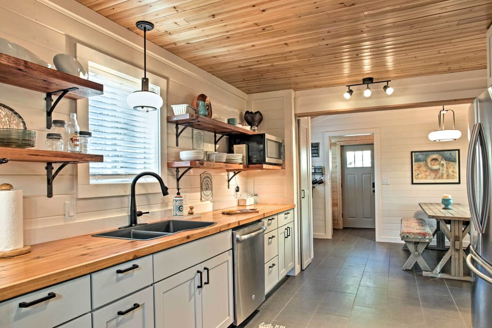 The well stocked gourmet kitchen is roomy and bright.