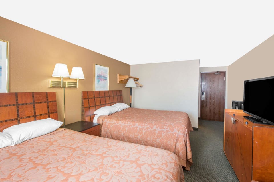 Standard Room, 2 Queen Beds | In-room safe, desk, iron/ironing board, free cribs/infant beds