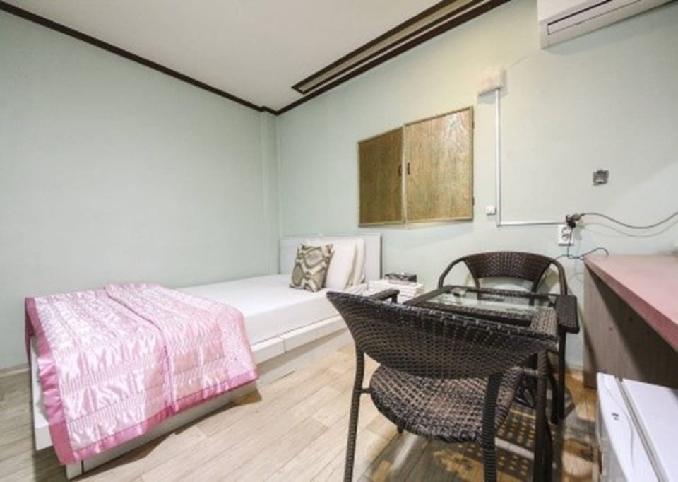 Premium bedding, desk, laptop workspace, blackout drapes