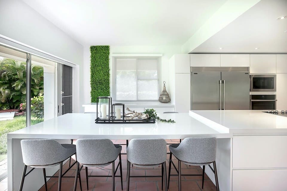 Kitchen counter has seating for 8