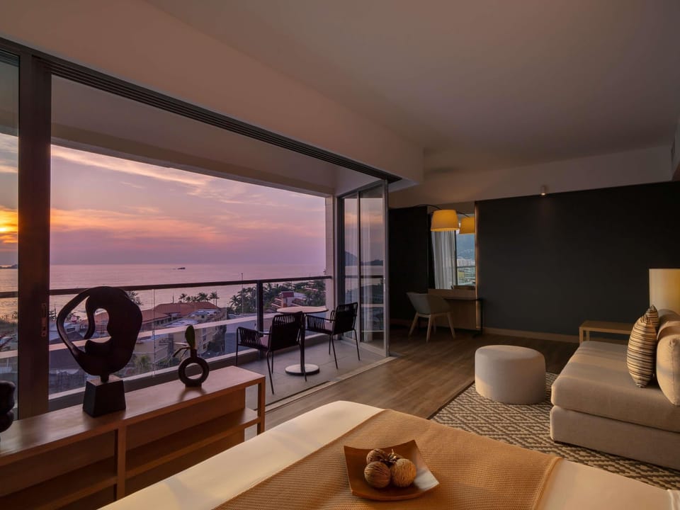 Suite, 1 King Bed, Balcony, Sea View | In-room safe, desk, laptop workspace, blackout drapes