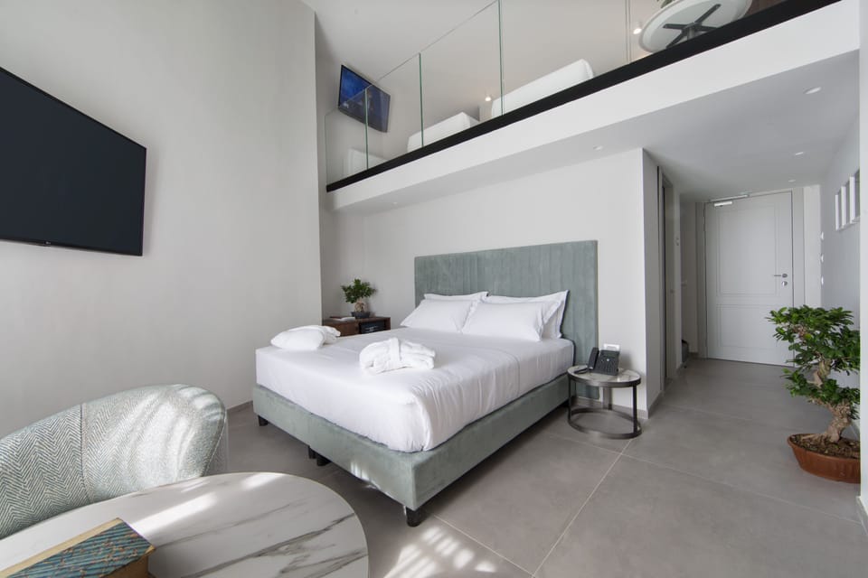 Family Quadruple Room | Down comforters, memory foam beds, minibar, in-room safe