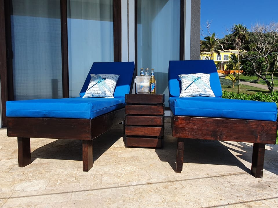 The lounge chairs outside of the suite overlooking the 38'x21' salt water pool.