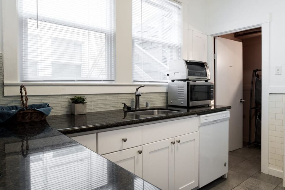Fully remodeled kitchen with all essential appliances, connected laundry room
