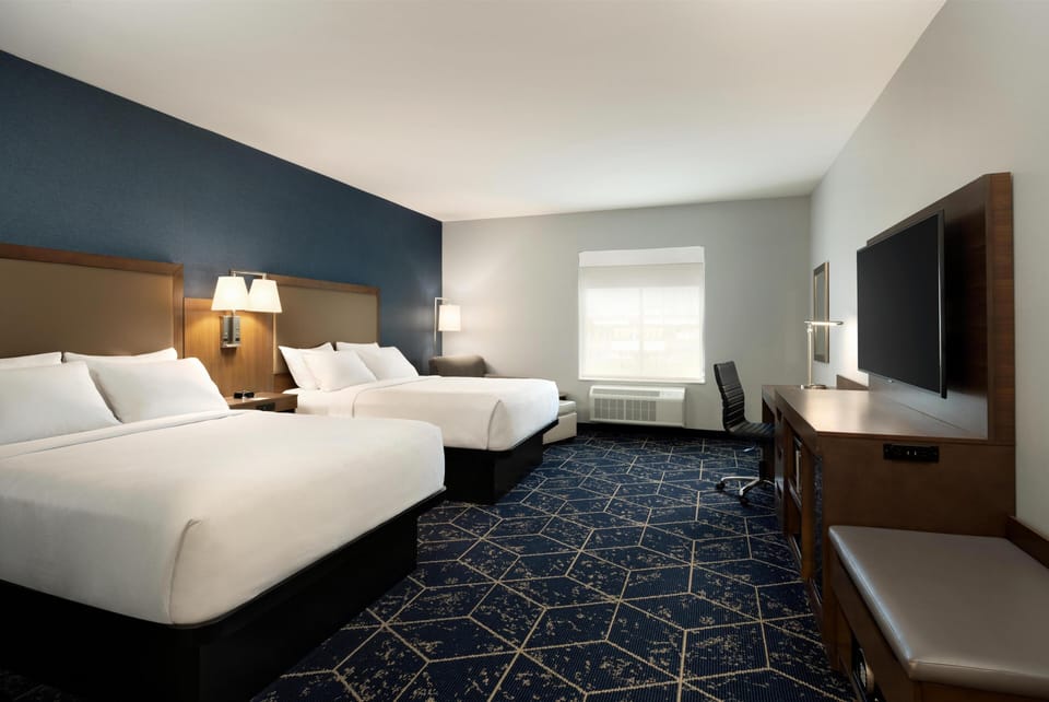 Room, 2 Queen Beds, Roll-in Shower | Pillowtop beds, in-room safe, desk, laptop workspace