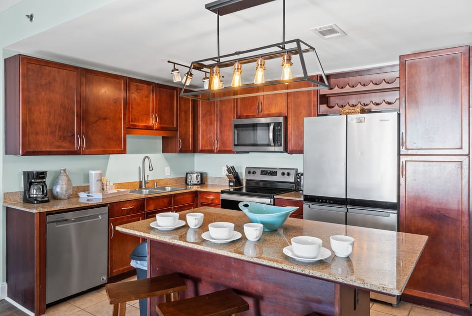 Fully Stocked Kitchen with Island Bar Seating