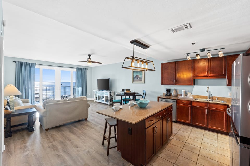 Fully Stocked Kitchen with Island Bar Seating