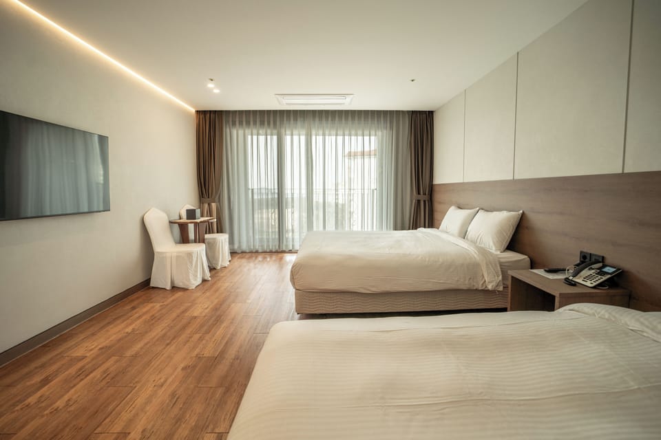 Corner Deluxe, Ocean View | Living area | 40-inch LCD TV with cable channels, TV