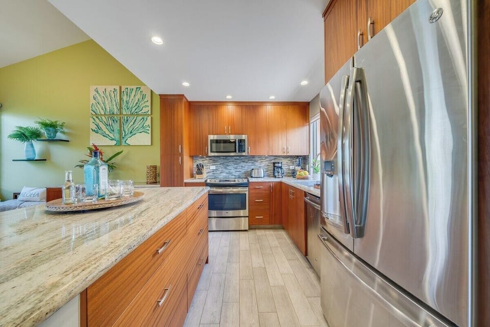 Beautiful updated kitchen with granite countertops and stainless steel appliances