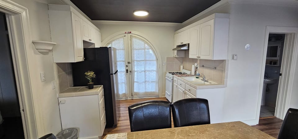 Two-Bedroom Family Suite with Kitchen | Private kitchen | Microwave, coffee/tea maker