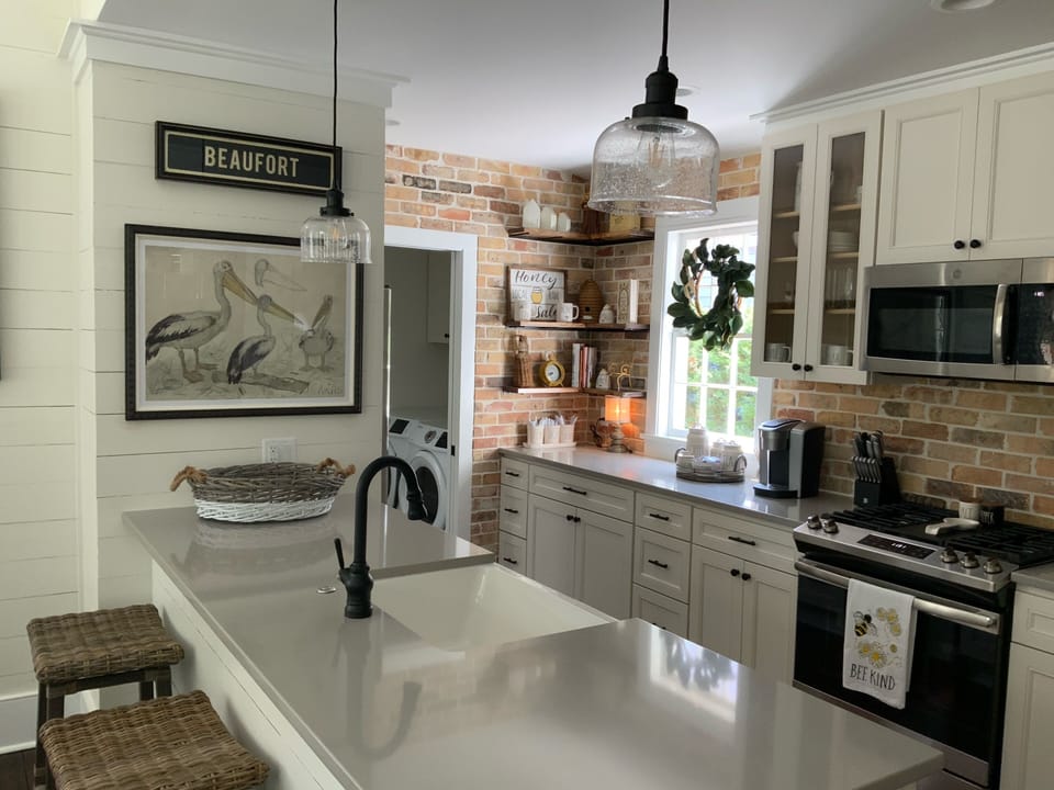 Kitchen has all stainless steel appliances and a Keurig coffee Maker