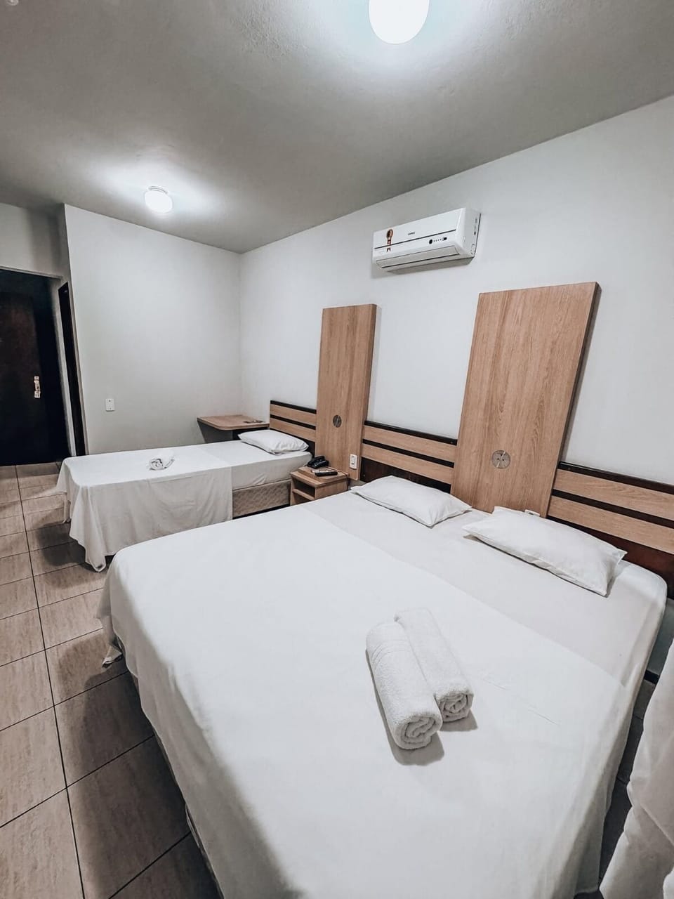 Triple Room | Minibar, blackout drapes, free WiFi, bed sheets