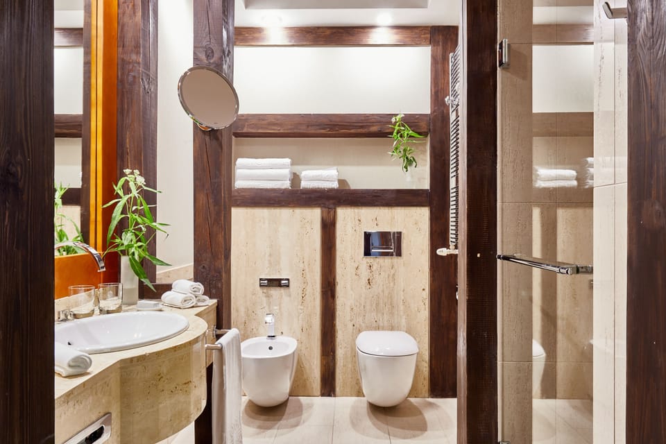 Grand Apartment | Bathroom | Hair dryer, bathrobes, slippers, towels
