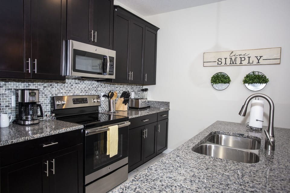 Townhome, 4 Bedrooms | Private kitchenette | Full-size fridge, microwave, oven, stovetop