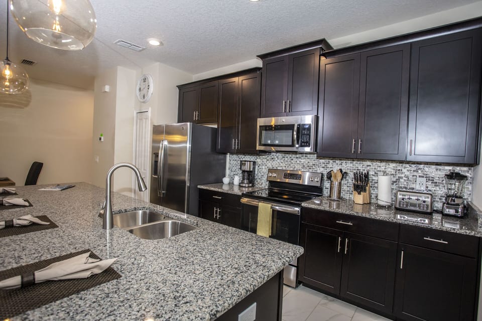 Townhome, 4 Bedrooms | Private kitchenette | Full-size fridge, microwave, oven, stovetop