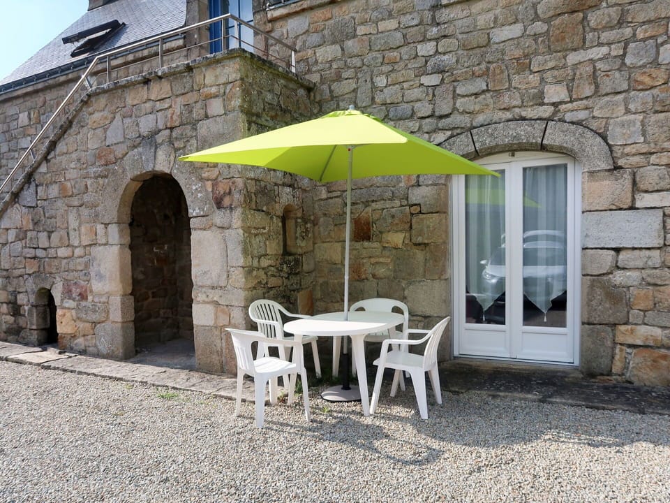 Furniture, Table, Chair, Building, Umbrella, Outdoor Table, Architecture, Outdoor Furniture, Shade, Window
