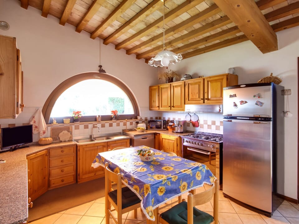 Villa | Private kitchen | Fridge, highchair