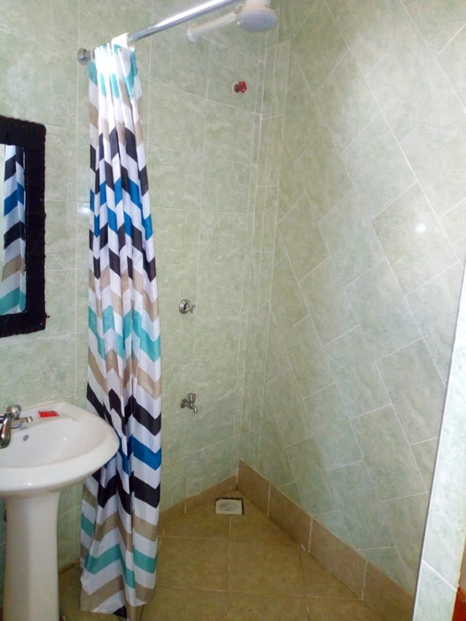 Standard Double Room | Bathroom | Shower, slippers, towels, soap