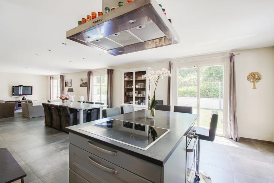 Villa | Private kitchen | Fridge, highchair