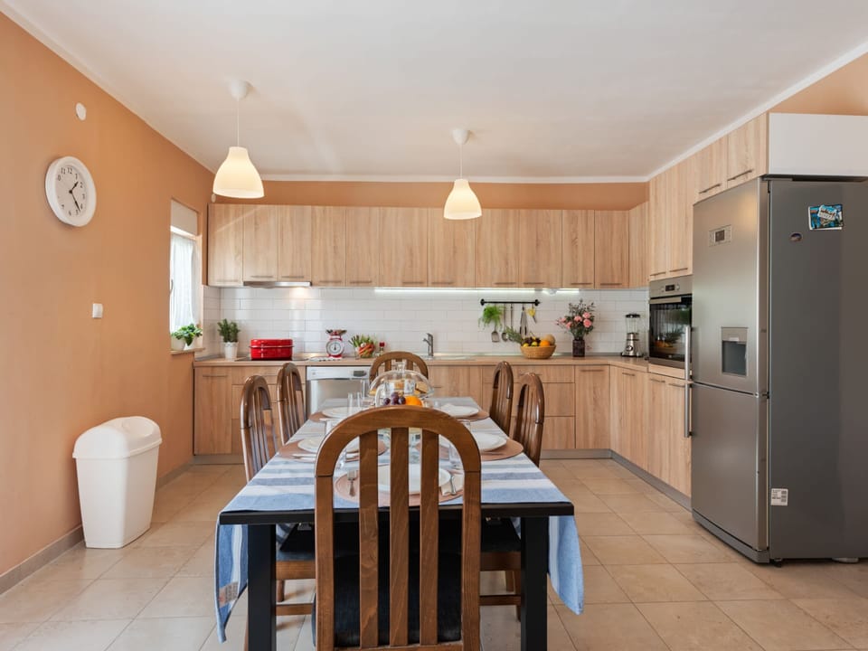 Villa | Private kitchen | Stovetop, electric kettle, toaster, highchair