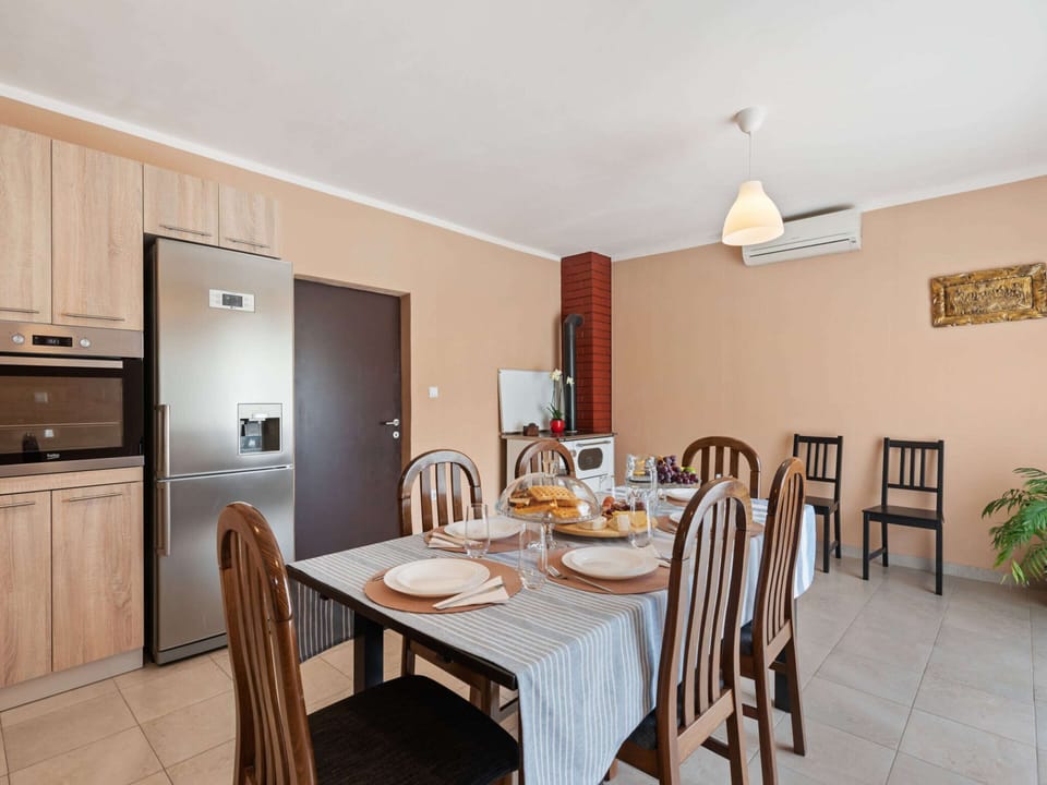 Villa | Private kitchen | Stovetop, electric kettle, toaster, highchair