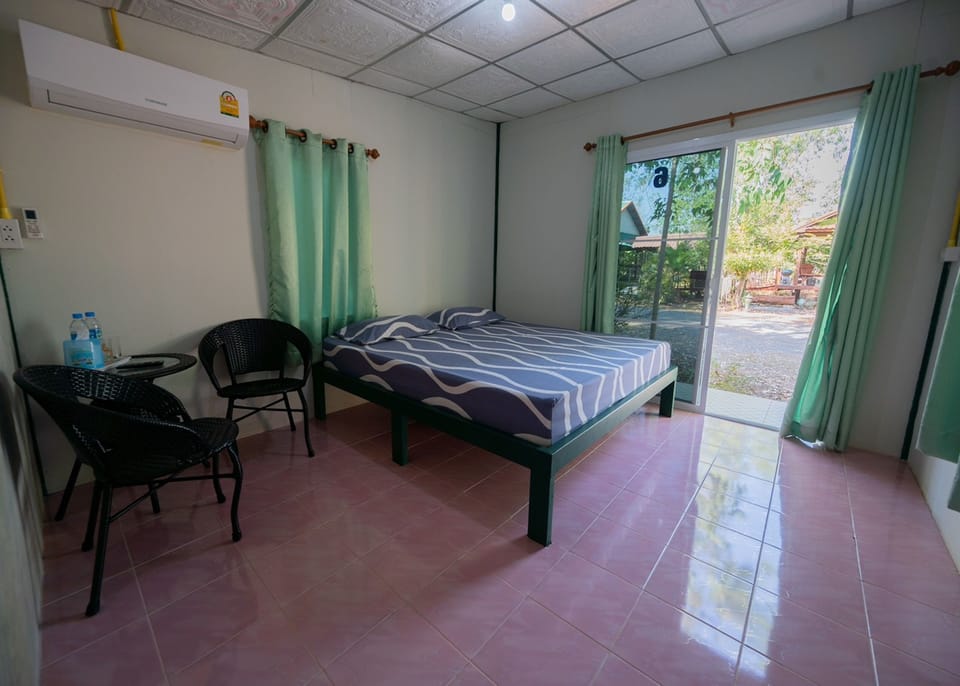 Desk, laptop workspace, bed sheets