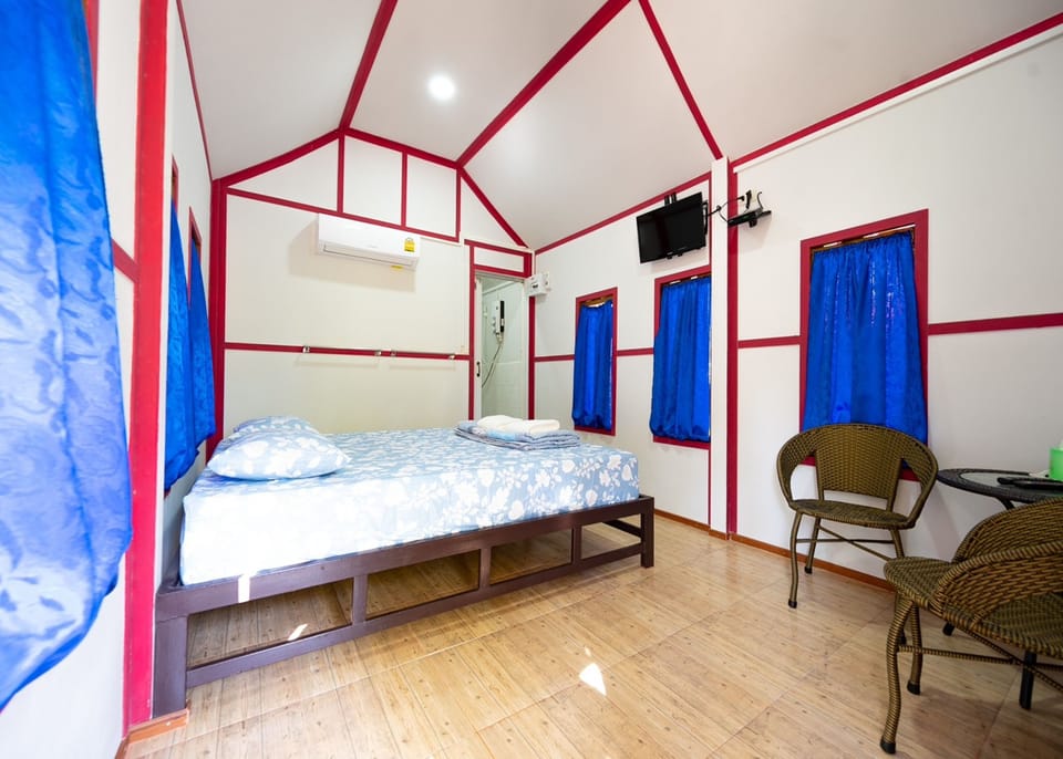 Desk, laptop workspace, bed sheets