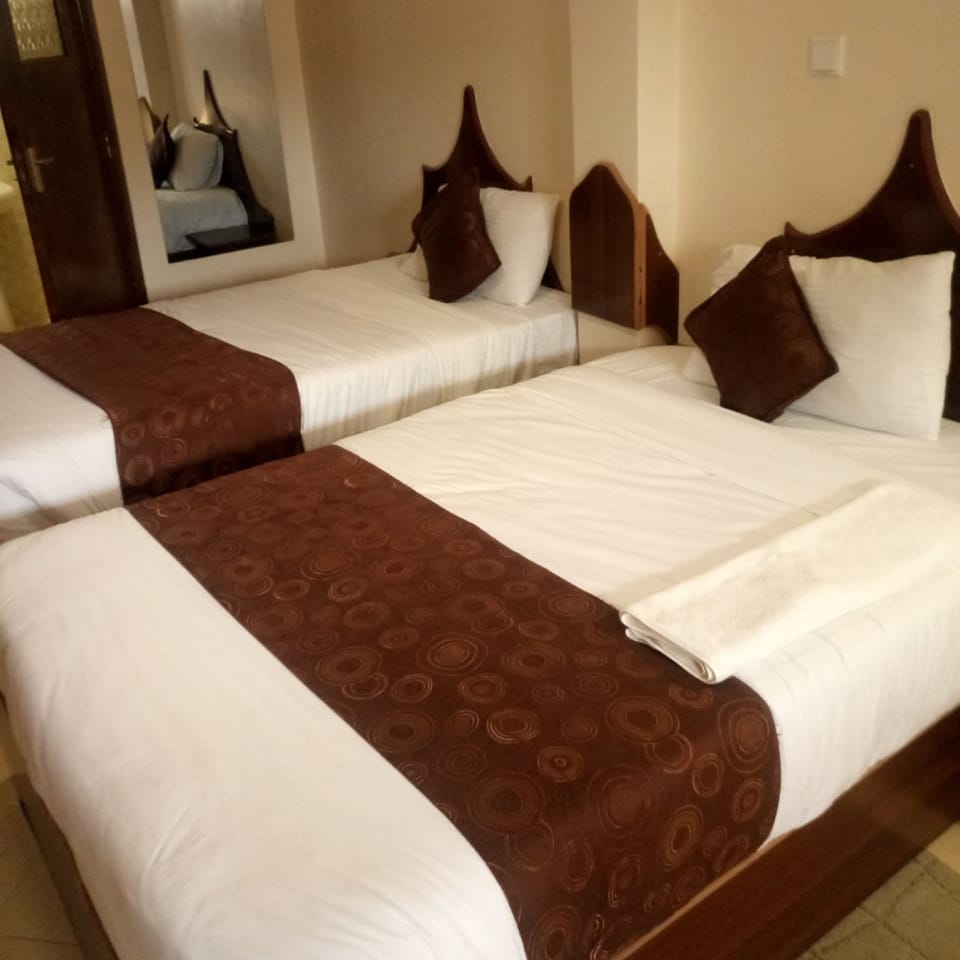 Twin Room | Desk, blackout drapes, iron/ironing board, free WiFi