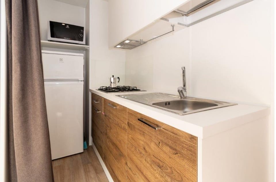 Deluxe Mobile Home, 2 Bedrooms | Private kitchen | Full-size fridge, microwave, stovetop, cookware/dishes/utensils