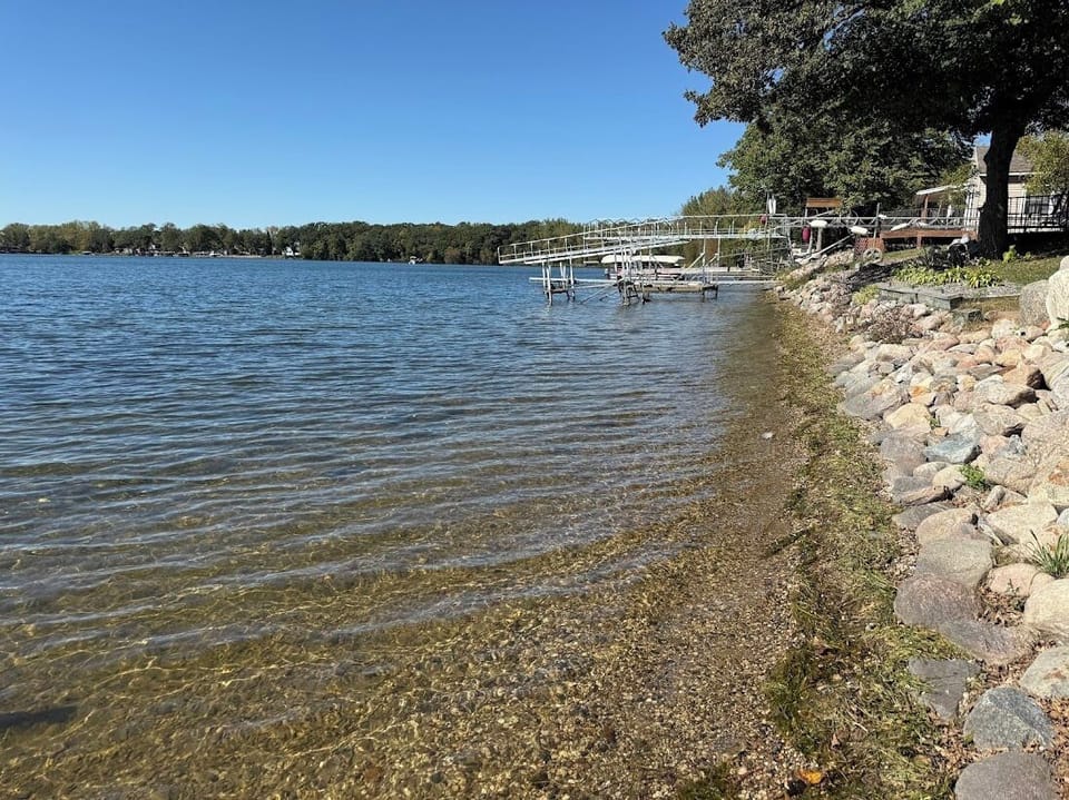 Sandy shoreline, the water in Lake Minnebelle is clean and clear